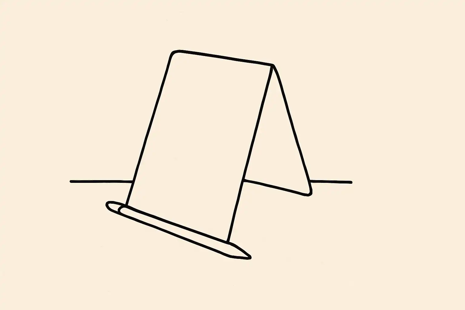 A folded menu and pencil on a bare table surface, ready for review